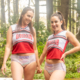 Alisha and Gabriella show off in their cheer uniforms and diapers.