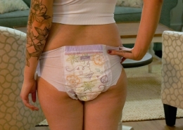 Acantha poses in her pull-on style diaper.