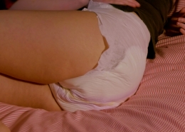 Close-up shot of Alisha wearing her wet diaper.